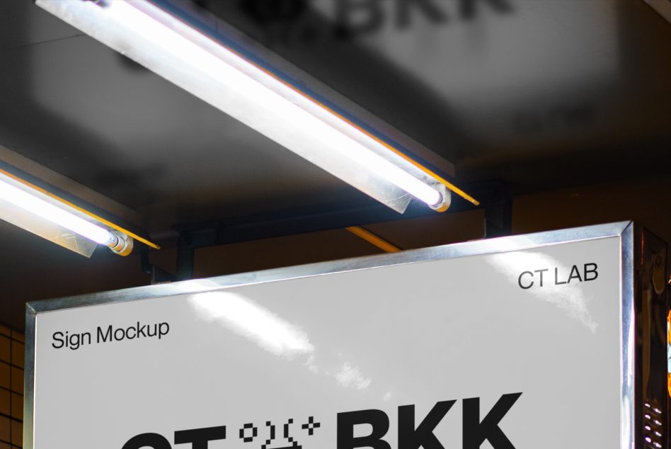 Minimalist white sign mockup with CT BKK text under fluorescent ceiling tubes overhead